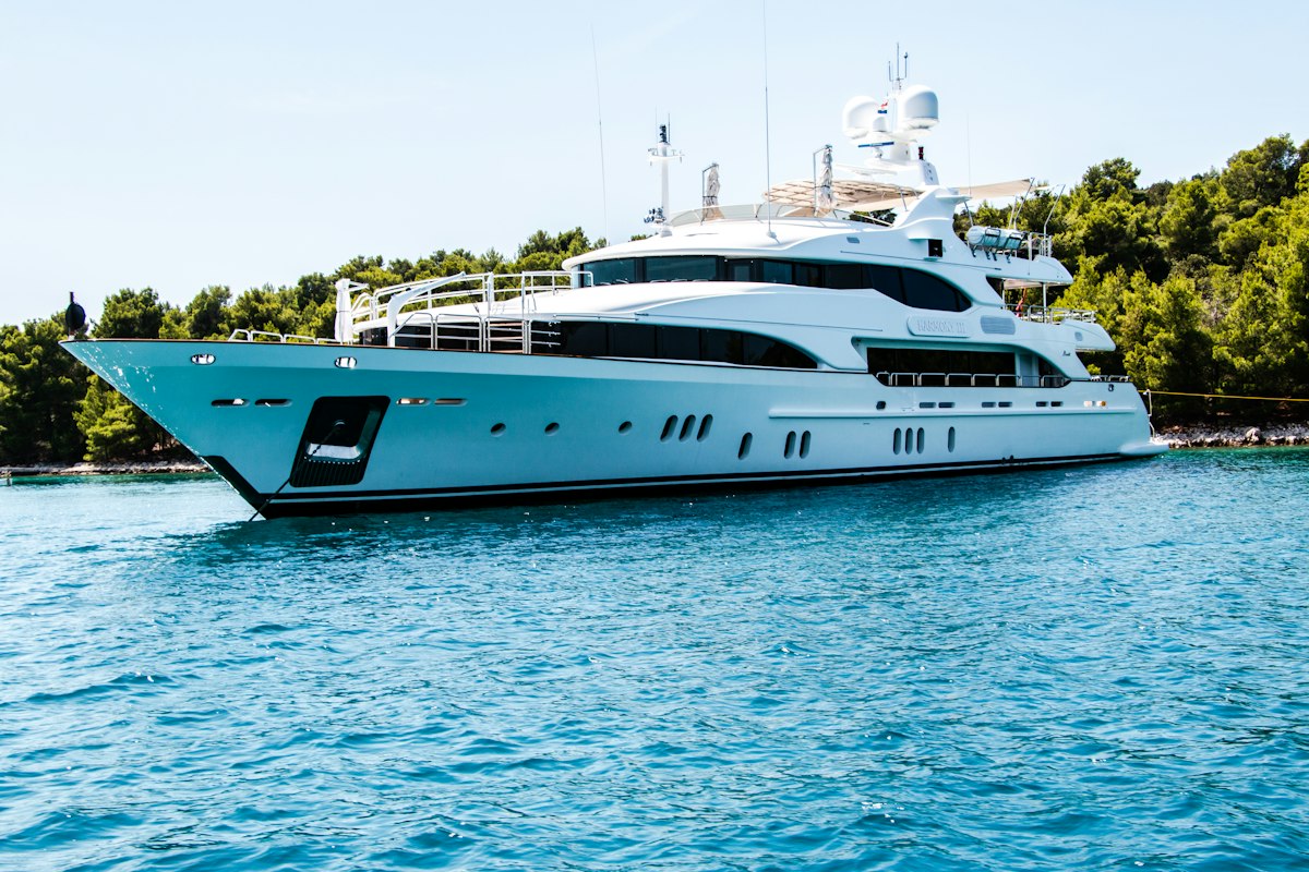 Luxury white yacht cruising Sydney Harbour - boat loans Australia